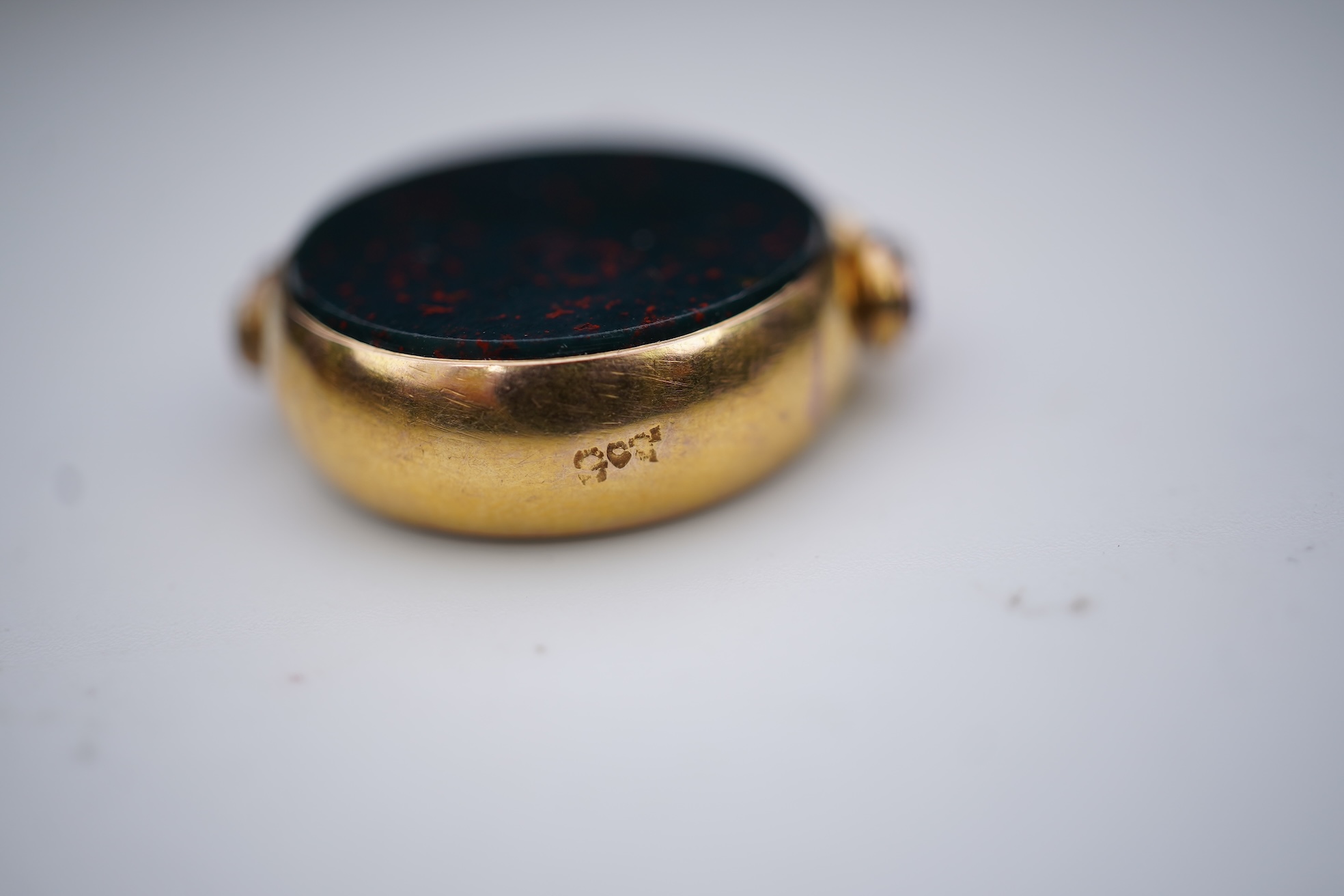 An enamel ring and a hardstone swivel fob seal